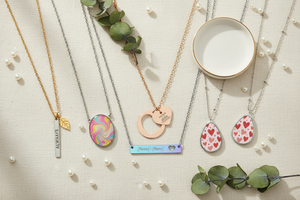 Luxurious jewelry showcase — elegant necklaces flat lay on cream linen with natural light