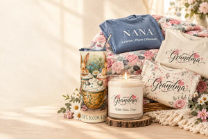 Warm editorial collage of personalized grandma gifts including a heart-script tumbler, soy candle, Nana shirt, floral plush blanket, and Grandma floral tee