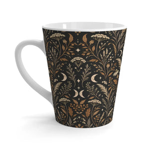 Black herbal silhouettes between moon phases on a DipaliZ mug