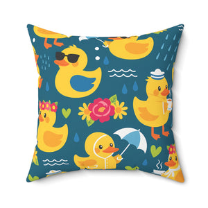 A square throw pillow featuring a whimsical cartoon rubber duck pattern on a dark teal background. The design includes yellow ducks in various playful poses, some wearing sunglasses, a flower crown, a raincoat and umbrella, and holding cups.