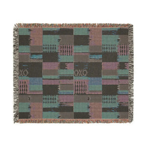 Southwestern geometric patchwork design by DipaliZ on a soft woven throw