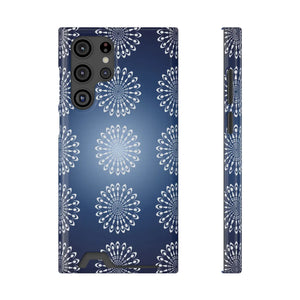 Concentric petal rings of the DipaliZ mandala design over a navy phone case.