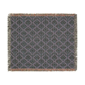 Folk textile chevron design on a woven DipaliZ throw for a sofa arm