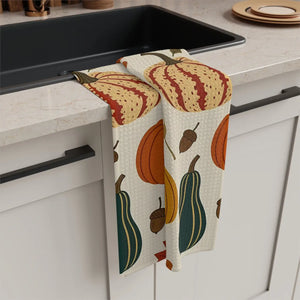 Pumpkins, gourds and acorns printed on a cream DipaliZ microfiber tea towel