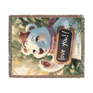 Polar bear woven blanket draped over a sofa