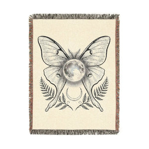 Celestial moth motif on a DipaliZ woven blanket for a witchy bedroom