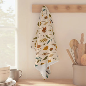 Cream fall tea towel from DipaliZ with a muted gold and teal print