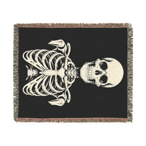 DipaliZ woven blanket showing a skeletal figure in high-contrast line work