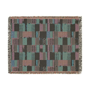 DipaliZ woven throw blanket, southwestern sampler pattern for a sofa arm