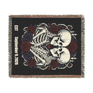 Kissing skulls and roses artwork on a DipaliZ throw blanket