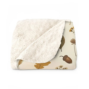 DipaliZ autumn throw folded at the end of a bed