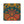 A square decorative print or textile featuring a festive Diwali-inspired design with orange marigold garlands, lit oil lamps, peacocks, and a large central mandala on a dark teal background.