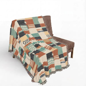 DipaliZ Southwestern Patchwork Woven Blanket with a grid of geometric motifs