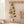 Hemmed cream tea towel from DipaliZ printed with autumn foliage