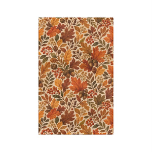 Lobed oak leaves and scattered acorns printed on a DipaliZ kitchen towel