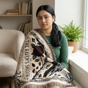 DipaliZ Raven and Rose woven blanket with The Raven's Shadow lettering