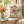 Muted rose-pink against cream in the DipaliZ botanical plate design