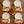 Painted pumpkins tucked among autumn florals on a DipaliZ dinner napkin