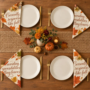 Set of four washable DipaliZ fall napkins with a light-hearted printed line