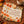 Rust and gold leaves at the border of a DipaliZ printed dinner napkin