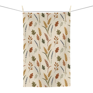 DipaliZ neutral fall tea towel resting on a kitchen counter