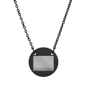 Black PVD coated round pendant by DipaliZ, engraving panel ready for a name or date