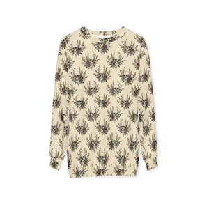 Pattern running unbroken from sleeve to hem on a DipaliZ cut-and-sew sweatshirt