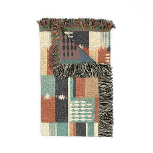 DipaliZ blanket printed with southwestern motifs in a repeating block layout