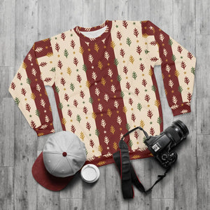 Warm rust-red ground under dark evergreen shapes on a DipaliZ pine tree sweatshirt