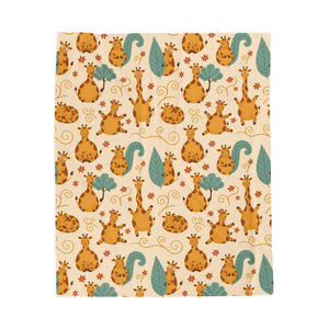 A rectangular fabric or paper sheet featuring a whimsical safari animal pattern with giraffes, squirrels, and leaves on a cream background, shown against a plain white backdrop.