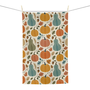 DipaliZ pumpkin tea towel laid across a wooden bread board