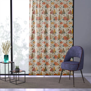 Pumpkins set among woodland foliage on a sheer DipaliZ curtain panel