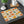 Pumpkins, squash and drifting leaves on a DipaliZ cotton twill placemat