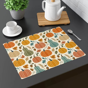 Pumpkins, squash and drifting leaves on a DipaliZ cotton twill placemat
