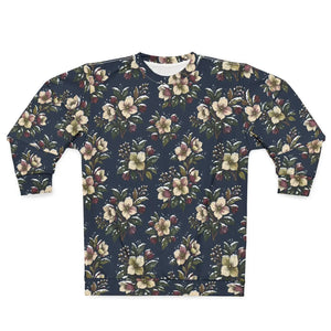 A long-sleeve crewneck sweatshirt featuring an all-over floral print on a dark navy blue background. The pattern includes cream, pink, and green flowers with brown accents, displayed flat against a solid white background.