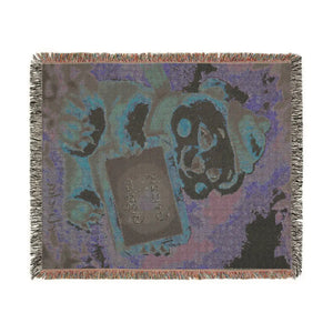Cotton woven bear blanket used as a lap throw