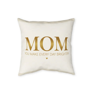 Warm neutral ground behind the gold script on a DipaliZ pillow cover