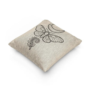 DipaliZ woven throw pillow with a moth beneath a crescent moon