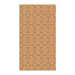 A rectangular area rug featuring a repeating geometric diamond pattern in terracotta orange, beige, and white, shown flat against a solid white background.