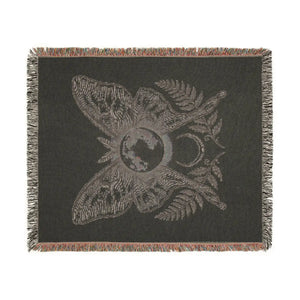 Flat graphic moth shapes across the DipaliZ woven throw blanket