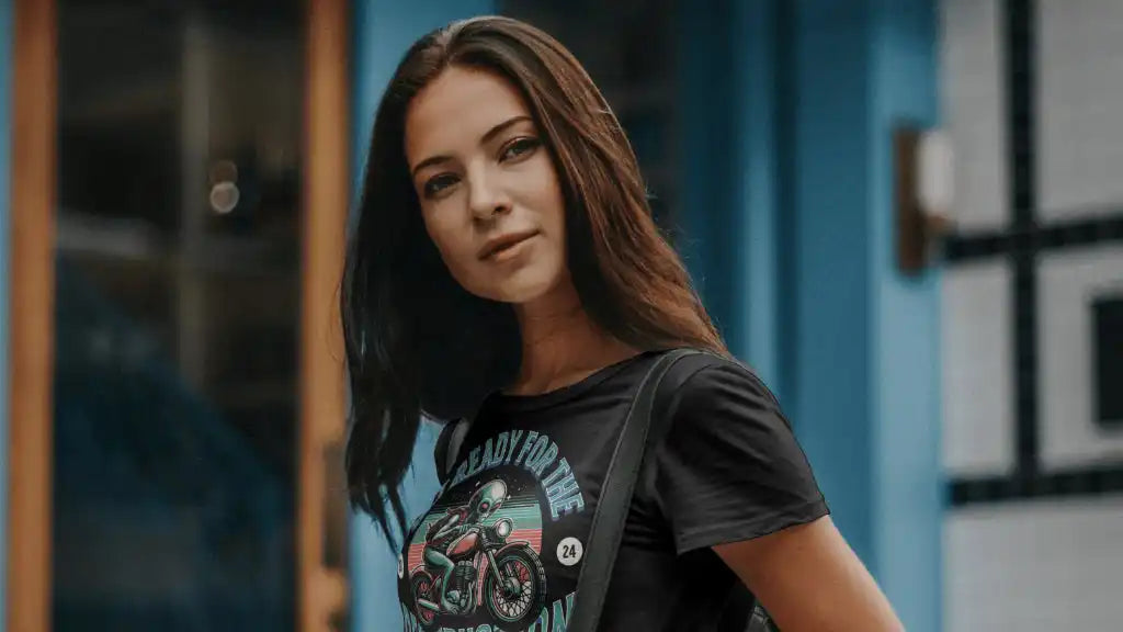 Young woman with long brown hair wearing a black graphic t-shirt