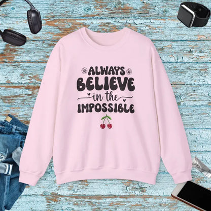 Unisex Heavy Blend Crewneck Sweatshirt Believe in the Impossible - Light Pink / s