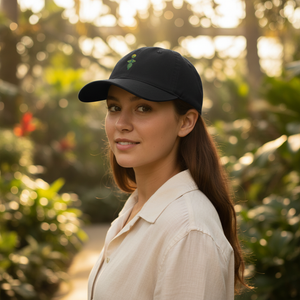 Black botanical hat worn in a garden