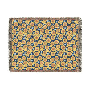 Flowers set at varying scales and angles on the DipaliZ woven throw