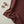 Flat lay of DipaliZ striped maroon combed cotton fabric by the yard