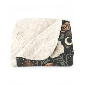 Trailing stems and five petal flowers on the DipaliZ moon and mushroom throw