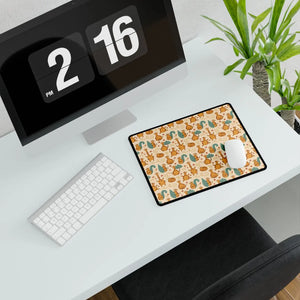Warm cream ground behind the ginger cats on the DipaliZ desk mat