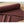 Striped maroon combed cotton fabric by DipaliZ draped to show the stripe rhythm