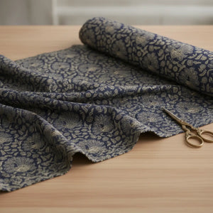 Navy peacock paisley cotton fabric by DipaliZ draped to show the pattern repeat