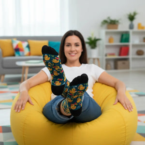 Stubby orange bills and dot eyes in the DipaliZ duck sock artwork